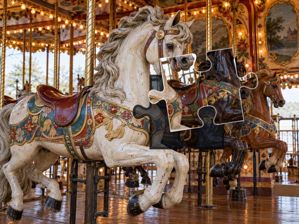 Three painted carousel horses among brass poles, warm bulbs and ornate vintage woodwork.
